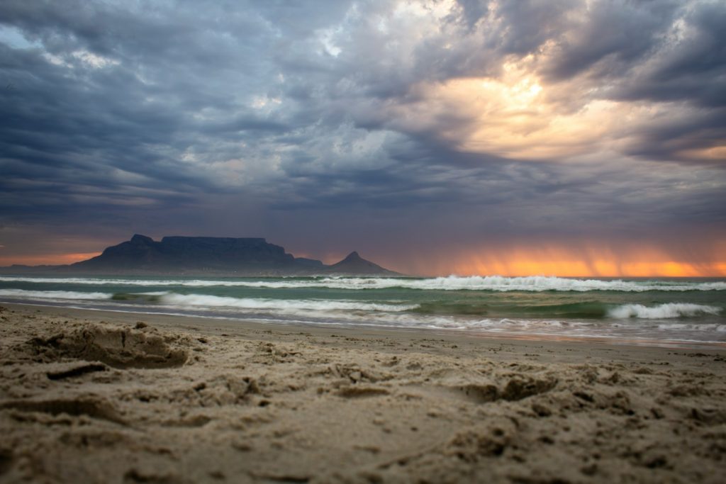 Dramatic sunset over the ocean with table mountain.